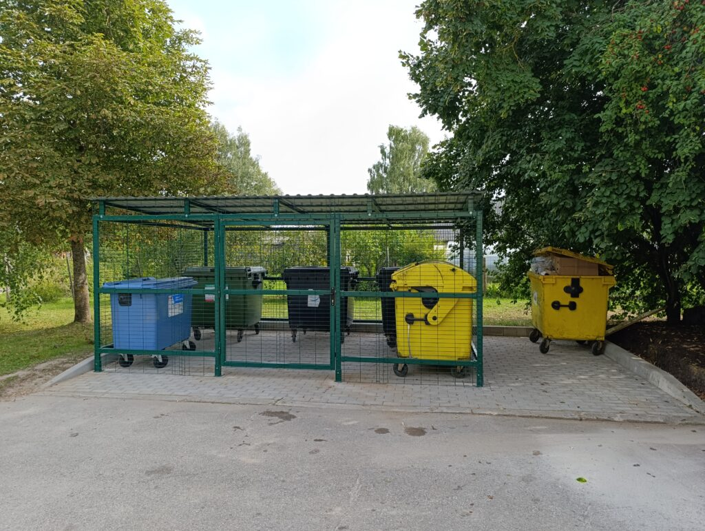 Outdoor waste bin shelters with mesh walls